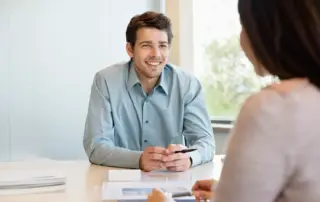 Man smiling in a job interview